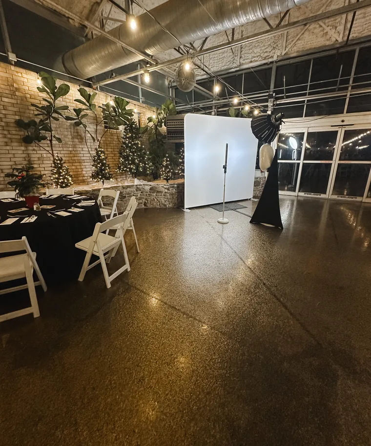 The booth and its backdrop set up in an event hall before guests arrive