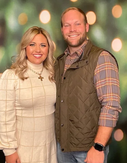 A couple at the booth during a company Christmas party